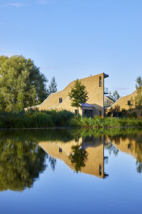 Contemporary lakeside home with wooden cladding, stone work and glazing, the house has a view over the lake
