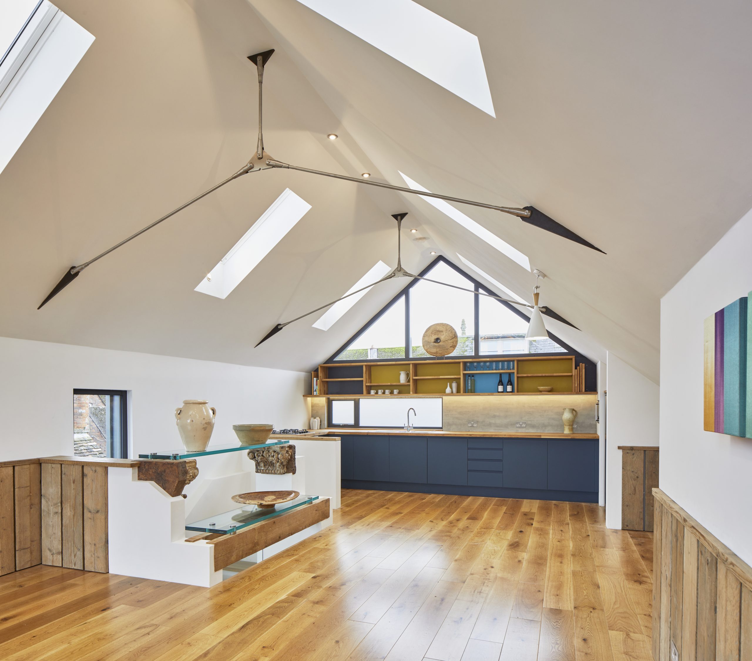 Contemporary loft apartment with its of windows modern art and wood floor